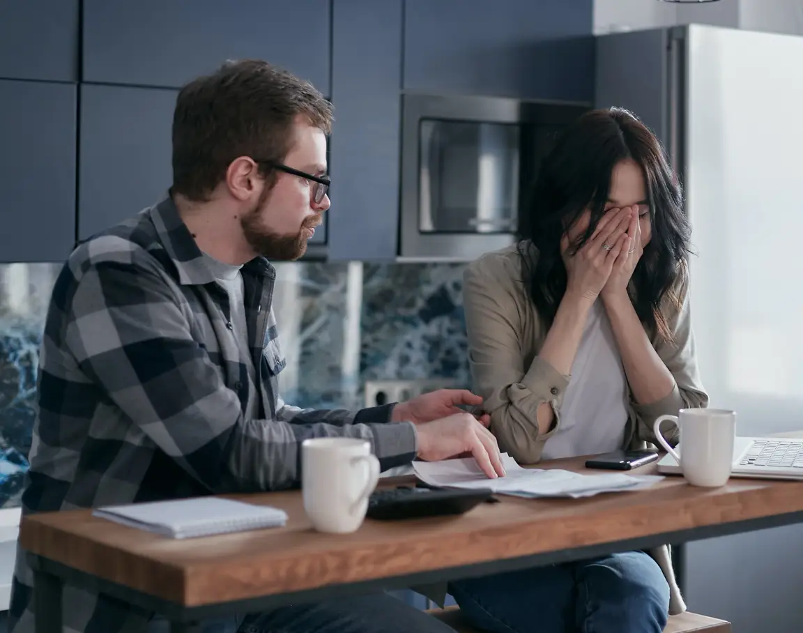 Homeowner reviewing tax forms after selling an inherited house in South Carolina – capital gains and tax consequences explained.