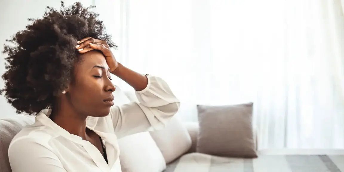 Stressed South Carolina woman reviewing an inherited property from her parents, symbolizing the challenges of selling an inherited house during probate.