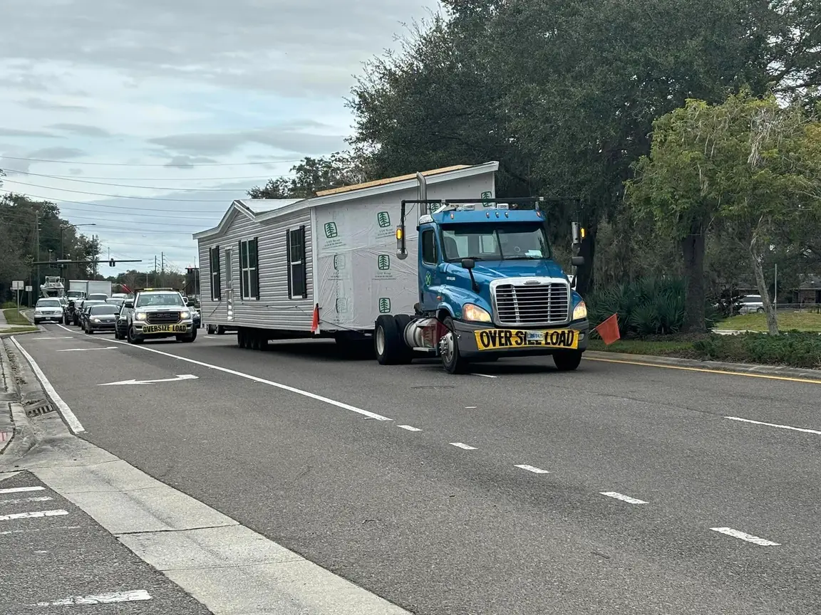 Truck hauling trailer - double wide trailer and singlewide mobile home