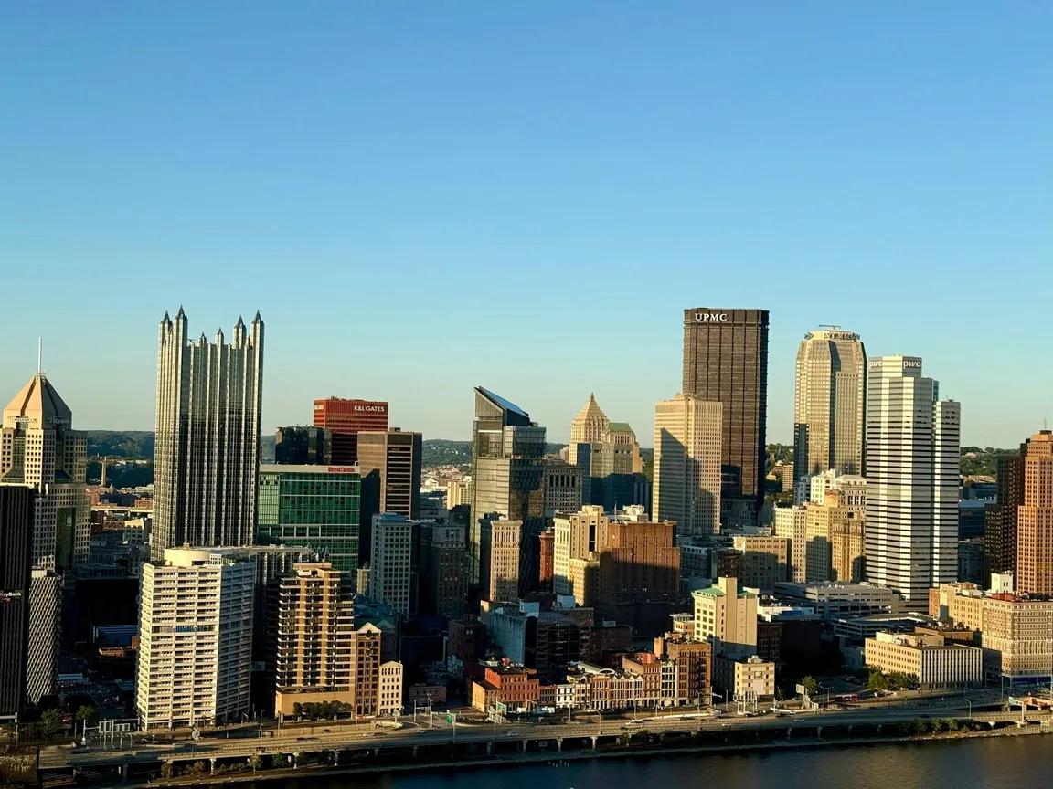 Pittsburgh skyline over the rivers — We Buy Houses Pittsburgh PA