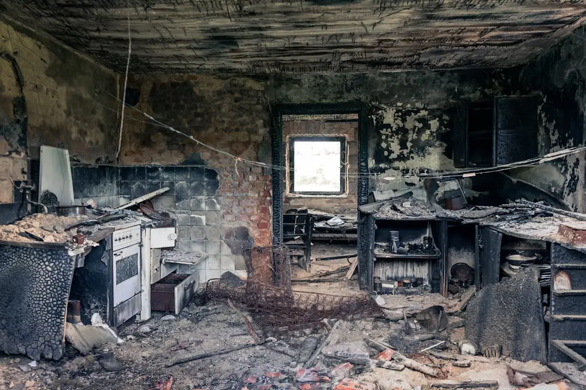 a burned room in a fire-damaged house