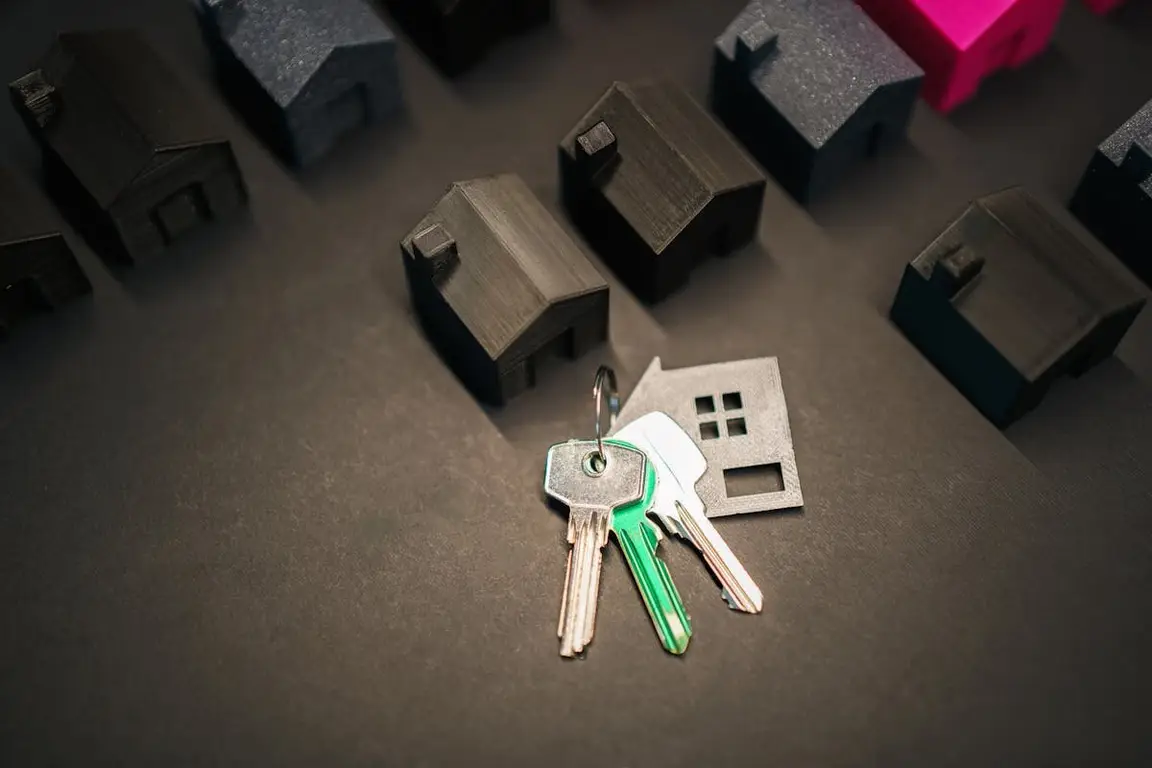 A bunch of keys next to a lineup of small houses