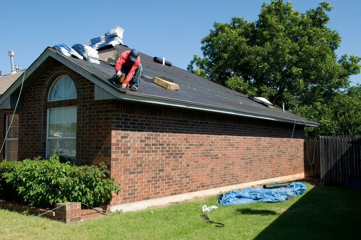 A local roofing contractor is working on a roof.