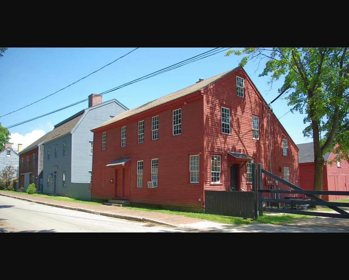 Historic residential street in Portsmouth, New Hampshire, representing a calm New England neighborhood where families settle inherited property