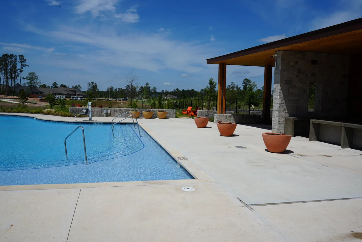Pool deck soft washing for a Millis Construction commercial property in The Woodlands, TX.