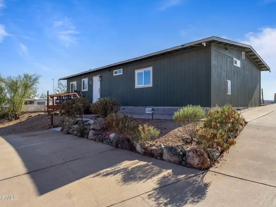 Large double-wide mobile home with deck in Tucson Arizona desert property