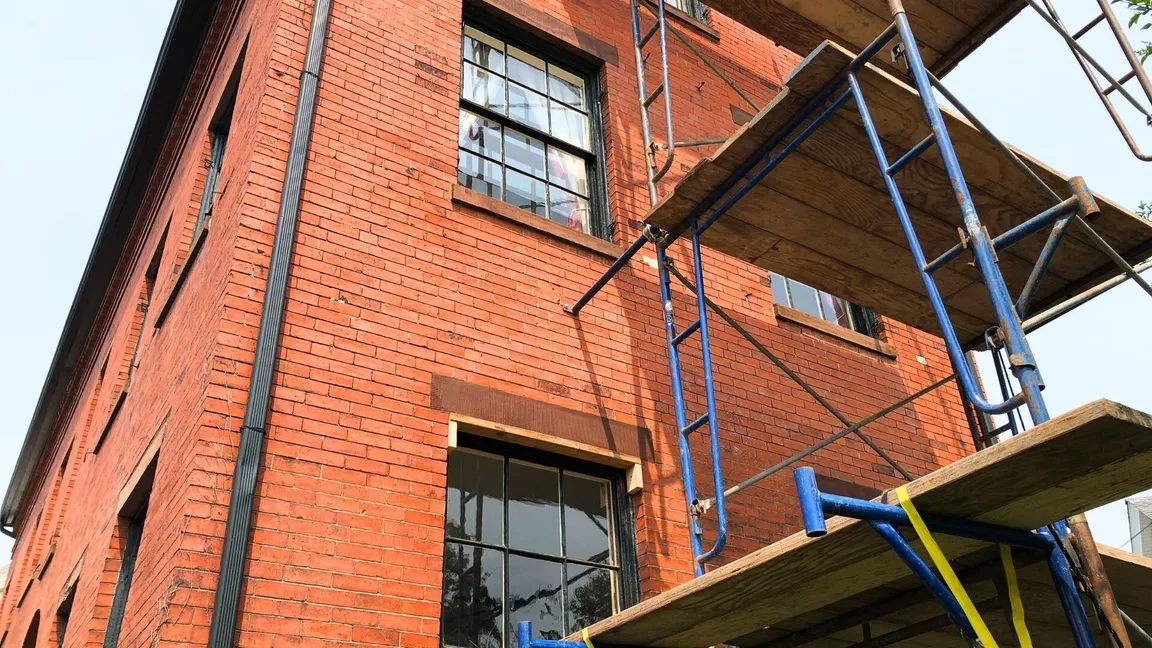 Foundation repair specialists leveling a sinking home in Cambridge MA