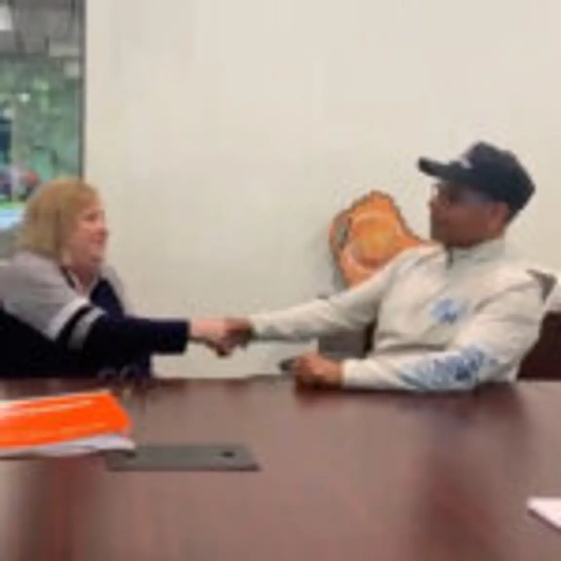 Darren and seller shaking hands on closing day