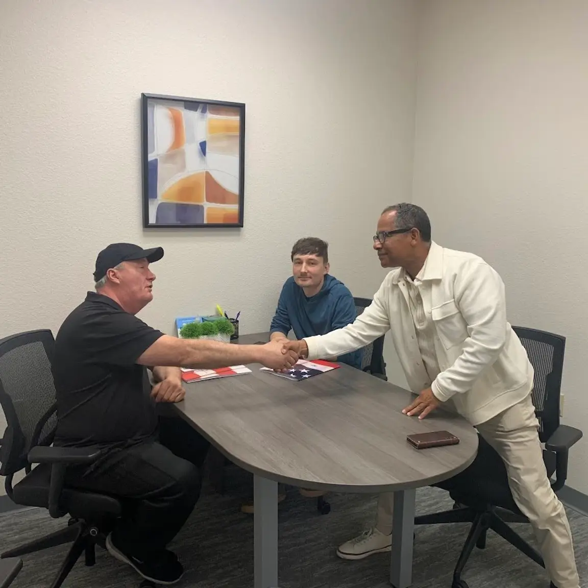 darren and seller at signing table on complicated deal. Darren sold this sacramento home with squatters, 28k in code vio;ations and sellers were in preforeclosure