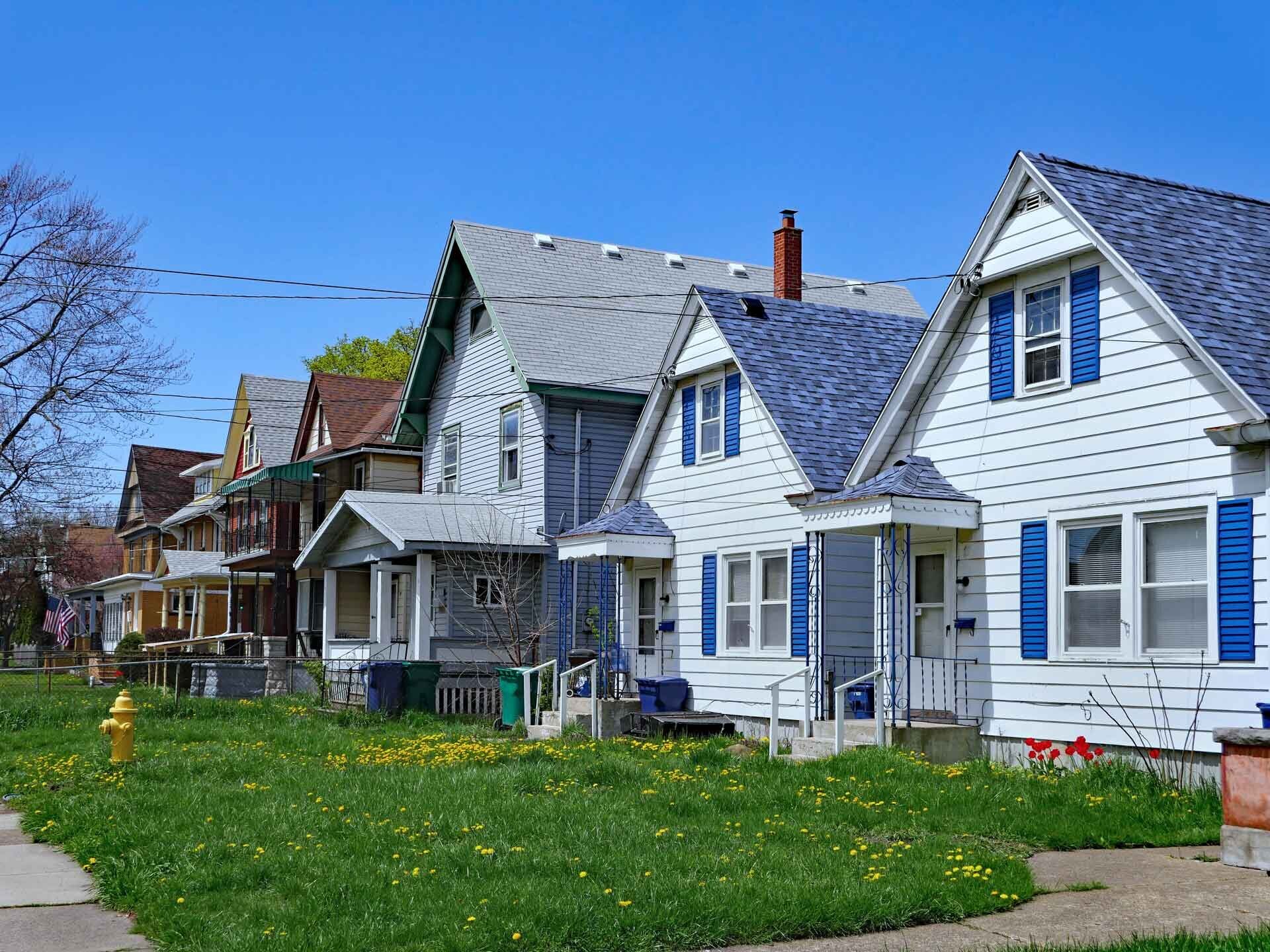 row of older homes on a sunny spring day