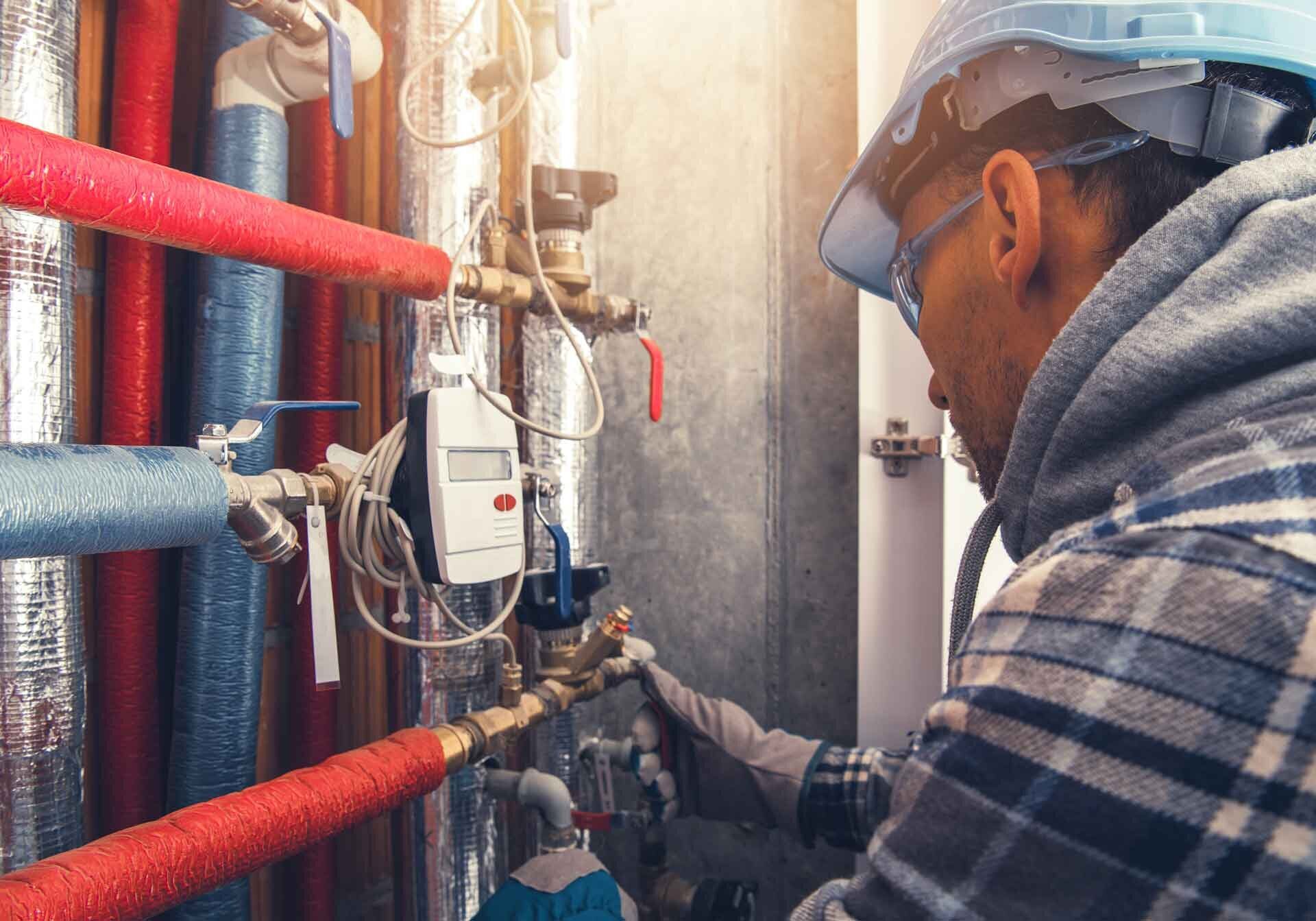 man checks water lines