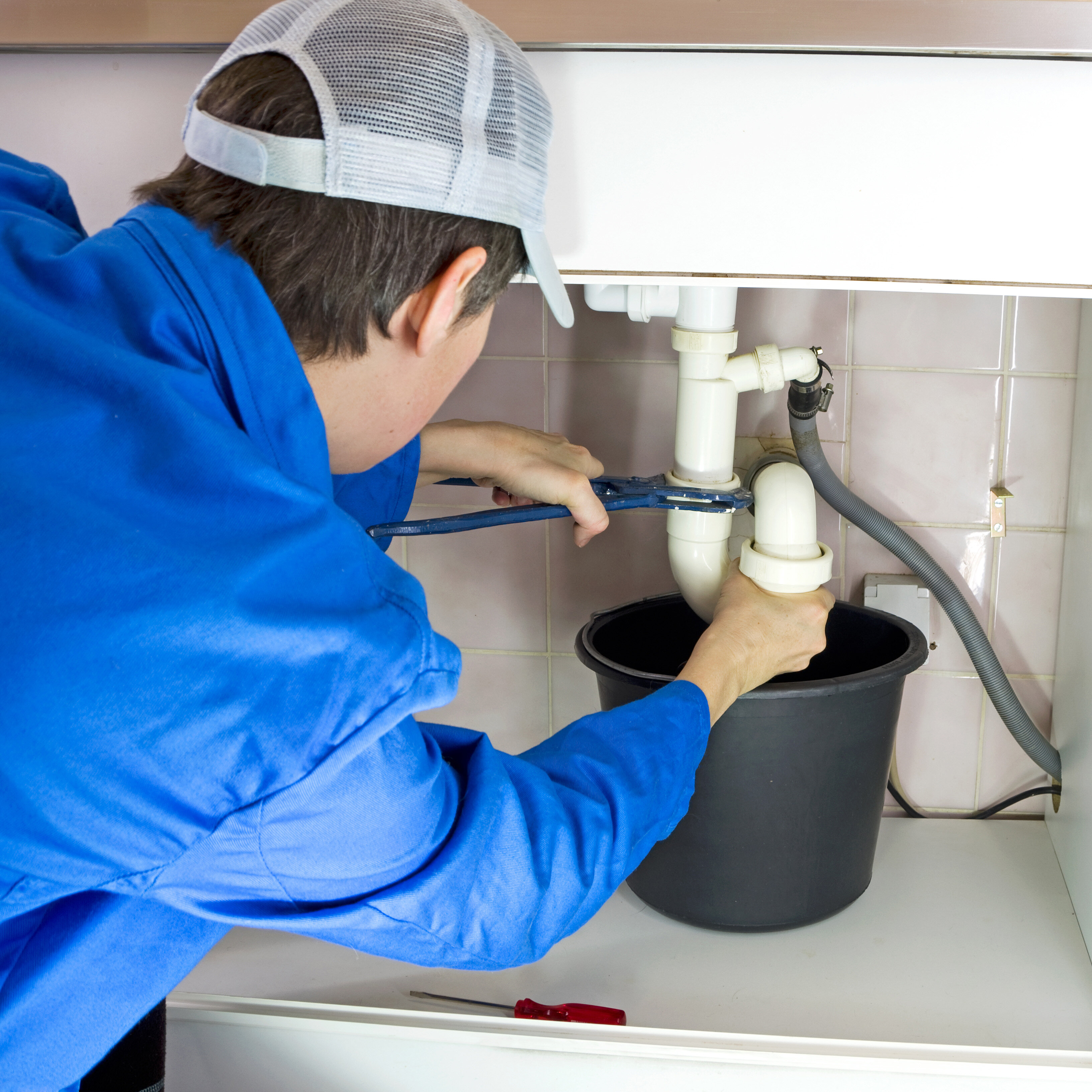  plumber servicing a drain