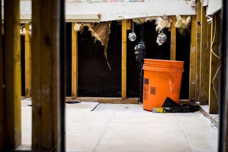 repairing walls in flooded house in Texas