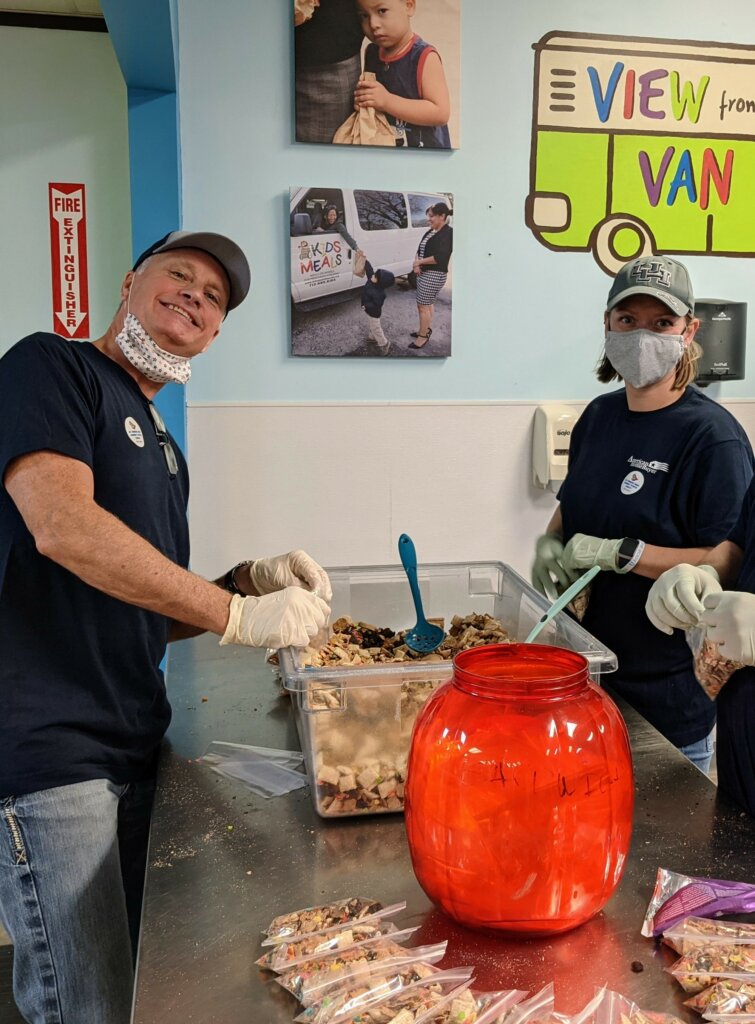 volunteers helping set up food