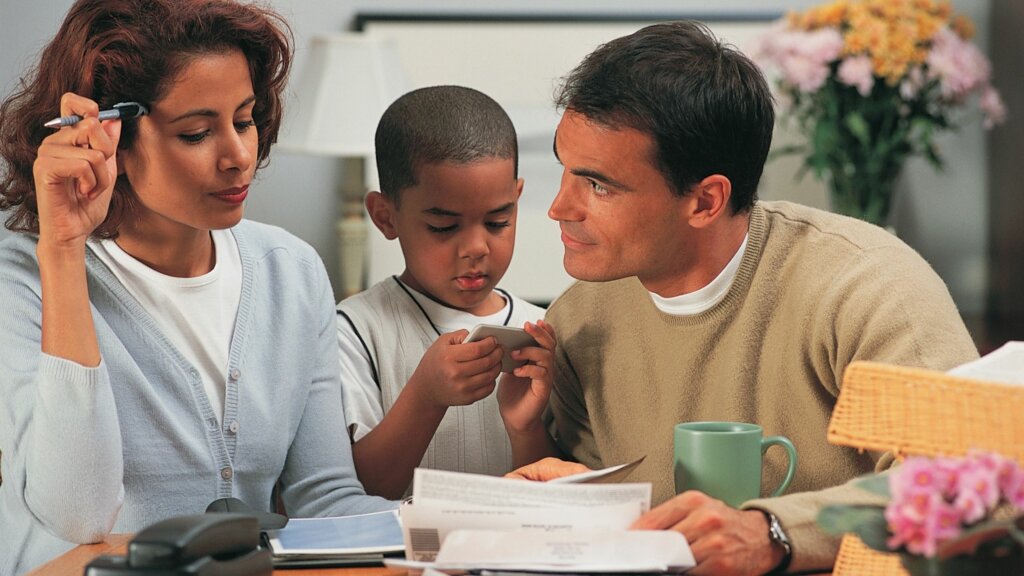 Couple from Chula Vista spends time looking over paperwork provided by a home investment company to make sure that their interests are protected during the quick sale for cash of their home.