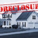 Foreclosed house graphic in Warner Robins or Hawkinsville Georgia with foreclosure stamped across the image
