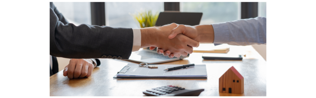 shaking hands after selling inherited house