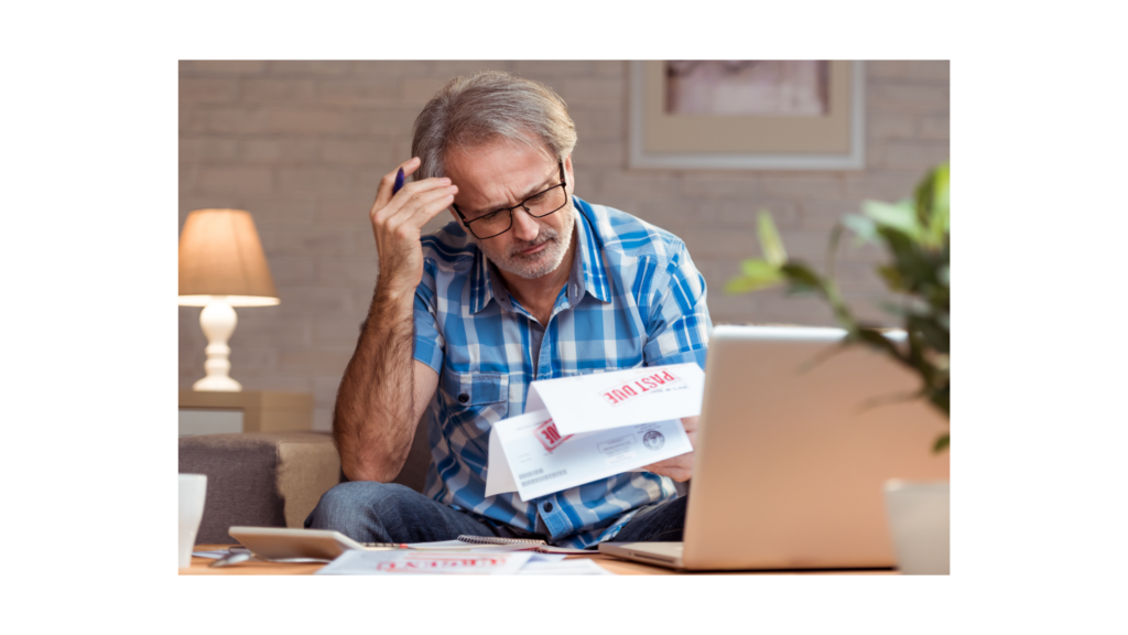 man looking over past due notices on his mortgage