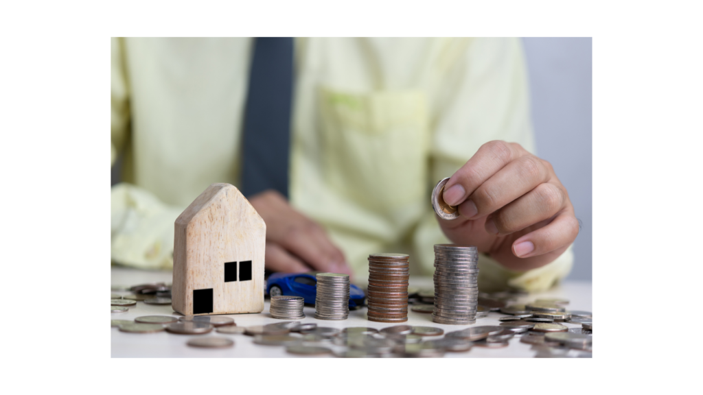 picture of house with coins stacked next to it