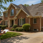 Home inspector reviewing a South Charlotte brick home with an older roof, HVAC unit, crawl space vent, and garage electrical area during a pre-sale inspection.