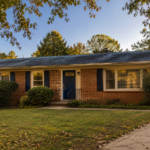 Single-story brick ranch home in a Charlotte, NC neighborhood with mature landscaping and a navy front door.