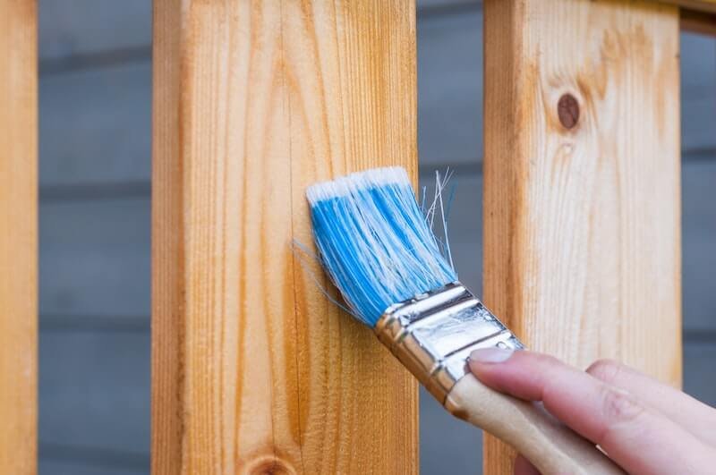 Painting a fence to help sell a house in Memphis, TN