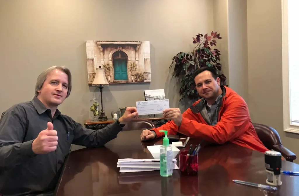 East Tennessee Home Buyers LLC helping a Knoxville homeowner sell a house for cash by completing the closing process