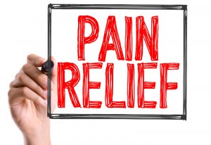 Hand with marker writing the word Pain Relief