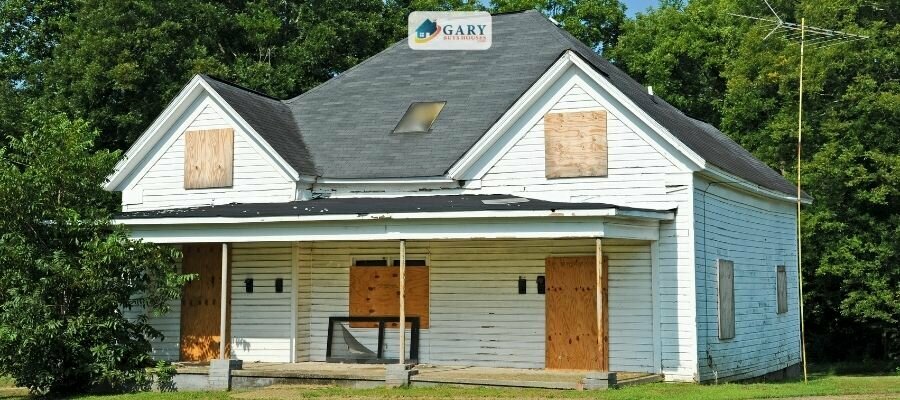 How to sell this white boarded up abandoned house