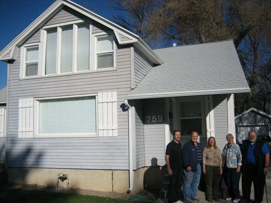 house with sellers in front we buy houses salt lake city