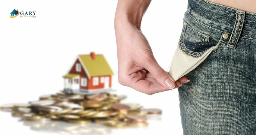 The homeowner is holding her empty pocket with a house that sits on top of coins in the background.