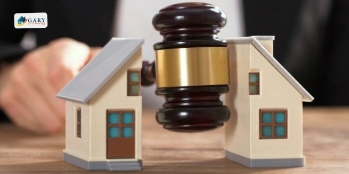 A man divided a mini-house using a gavel.