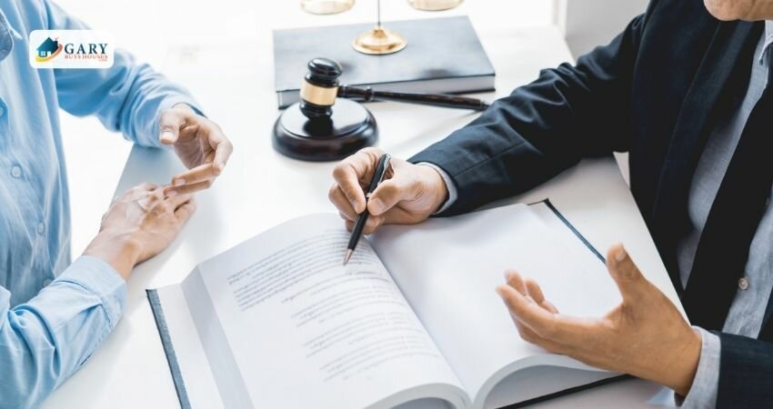 Lawyer and his client discussing contract papers.