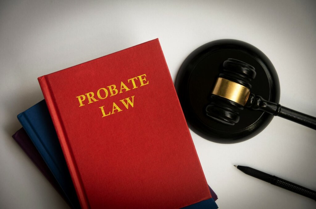 Top view of probate law book with gavel on white background. Law concept.
