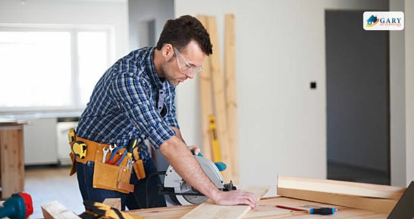 A man fixing the furniture of the house