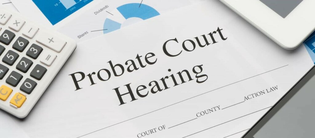 A probate hearing notice and a calculator.