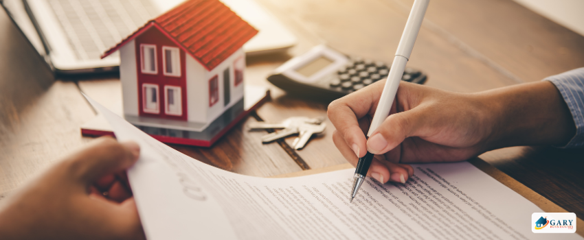 Signing paperwork for a house