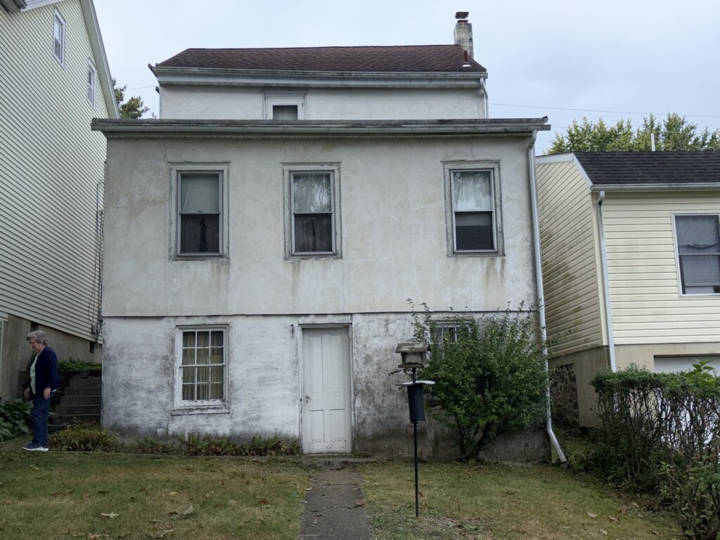 Exterior view of a long-time family home in Berks County Pennsylvania sold as-is through a cash home sale, showing a property needing updates before transfer.