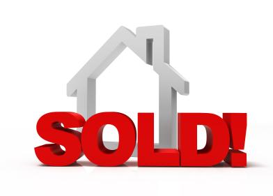 image of a house with a sold sign in front