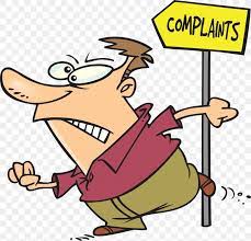 a man walking fast past a sign that says "complaints"