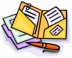 group of documents on a table with a pen