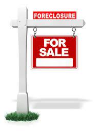 For Sale Sign with the word "foreclosure" on top signifying that this sale is a foreclosure sale.
