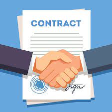 hands shaking in front of a contract referring to a "contractual agreement"