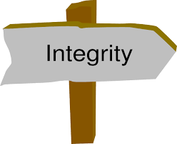A sign on a stake with the word "Integrity" on it
