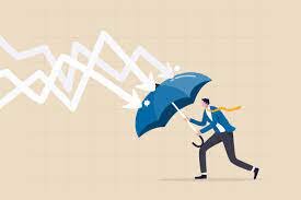 Man holding an umbrella, protecting himself from the world coming at him signifying resilience.