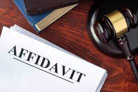 An affidavit on a wooden desk, looking like its in a law office referring to it being legal.
