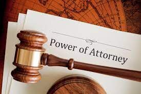 Image of a power of attorney, POA on a wooden table with a gavel representing the law.