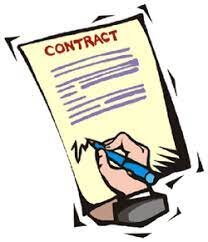 An image of a man, holding a pen and signing a purchase agreement for real estate.