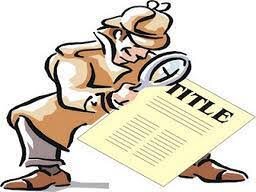 A man standing over a real estate title holding a magnifying glass, as if he is inspecting it, in reference to a title report.