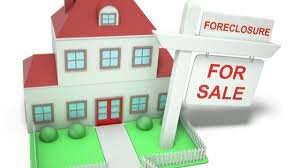 image of a house with a foreclosure sign in front of it signifying foreclosure rates